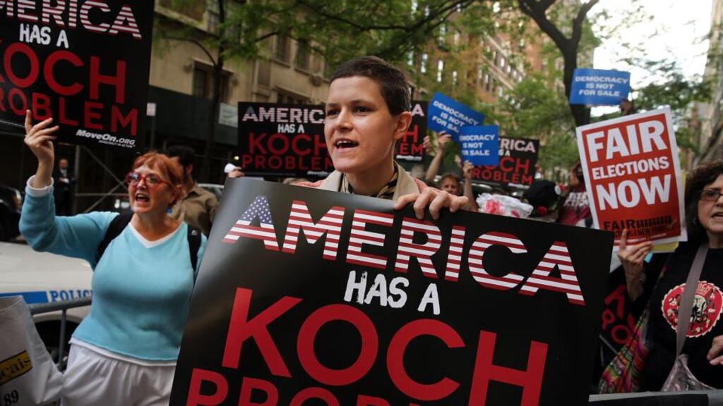 Activists protest near the Manhattan apartment of billionaire and Republican financier David Koch last June in New York City. The demonstrators were protesting against the campaign contributions by the billionaire Koch brothers. Photograph: Spencer Platt/Getty Images