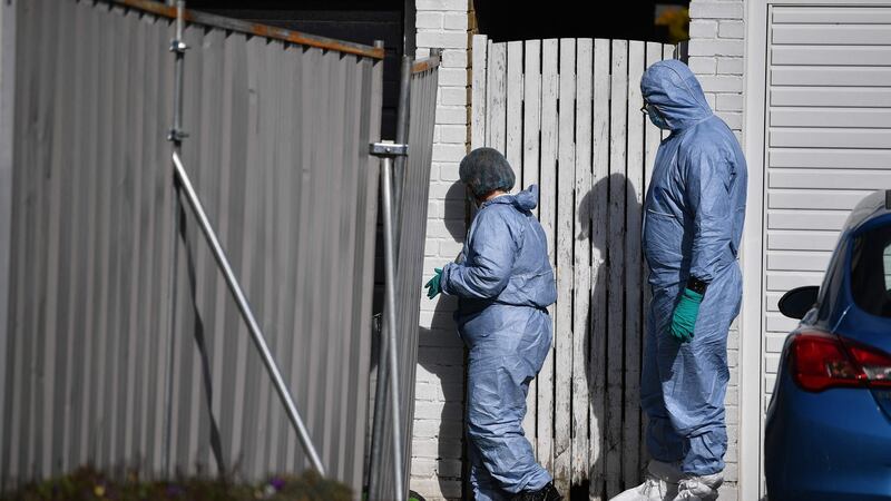 Members of a forensics team walk outside the home of a murder suspect in Deal, Kent. Photograph: Ben Stansall/ AFP via Getty