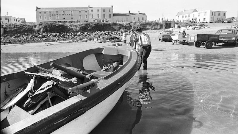 A garda pulling a boat containing part of the wreckage of Lord Mountbatten’s boat Shadow V at Mullaghmore. File photograph: Pat Langan