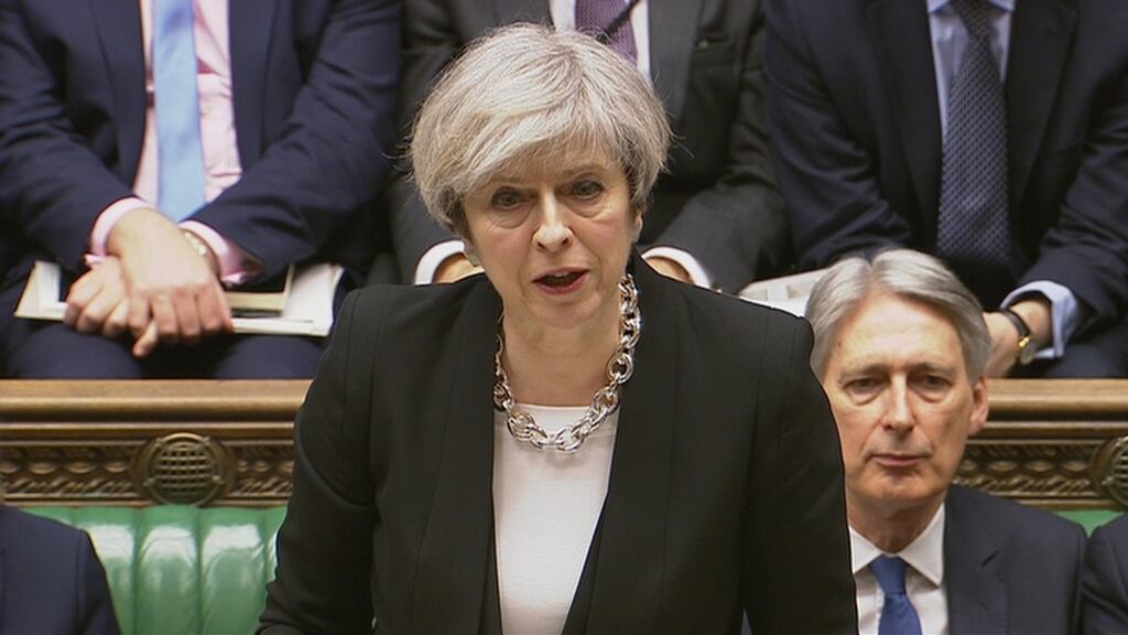 British prime minister Theresa May. When she sat down, May was hunched and still as she heard Jeremy Corbyn and other party leaders praise her response to the attack. Photograph: Parliament TV/via Reuters