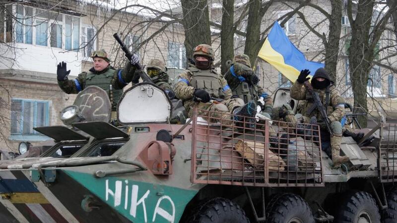 An armoured personal carrier (APC) of Ukrainian forces patrols the street of Volnovakha city. Photograph: Alexander Ermoochenko/EPA