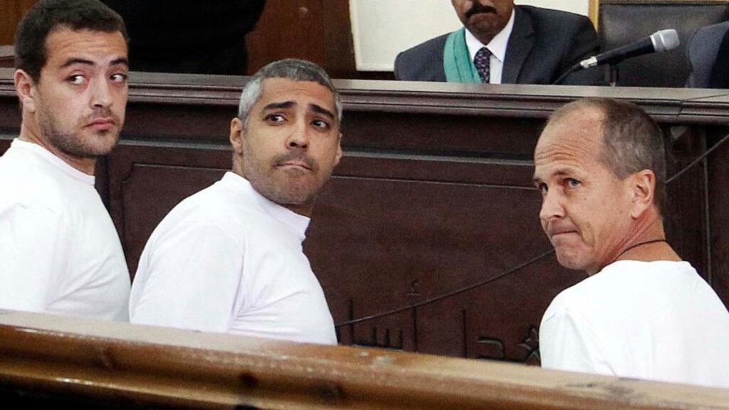 Al Jazeera English producer Baher Mohamed (left), Canadian-Egyptian acting Cairo bureau chief Mohammed Fahmy, and correspondent Peter Greste were arrested in Cairo on charges of aiding the banned Muslim Brotherhood, and the spreading of propaganda. Photograph: AP