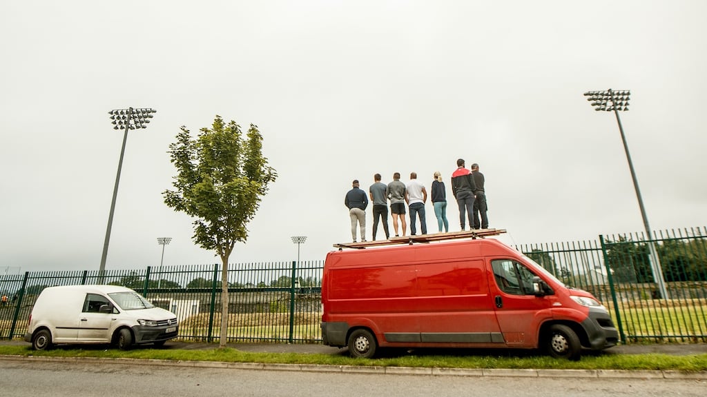 Lismore fans look on from outside the ground during the Waterford SHC quarter-final against Abbeyside Ballinacourty at Fraher Field in Dungarvan. Photograph: James Crombie/Inpho