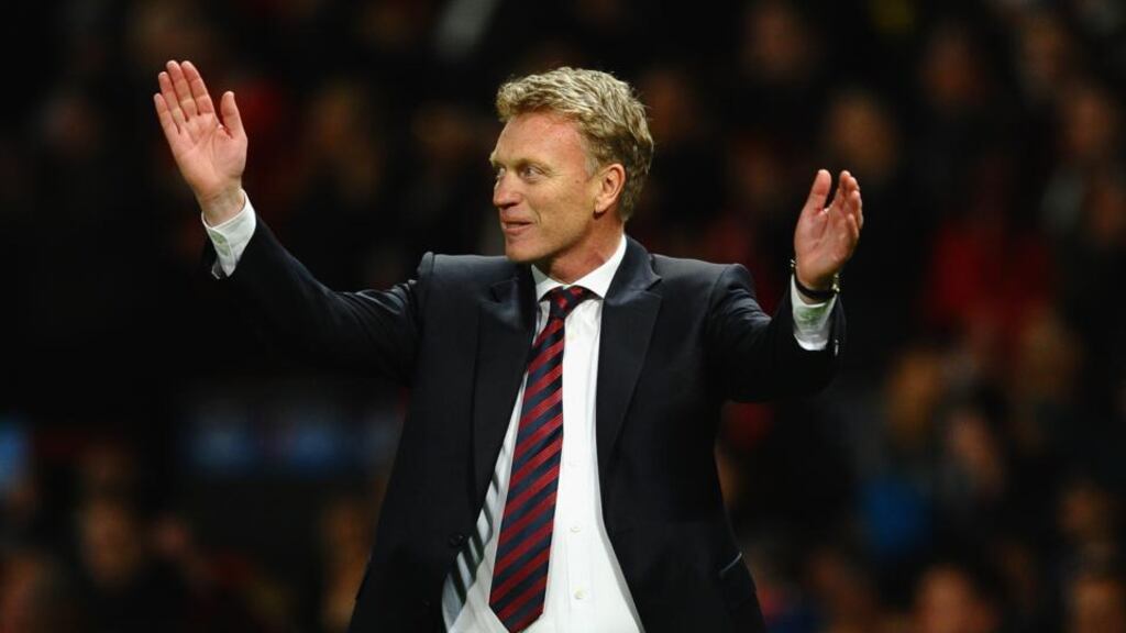 Manchester United manager David Moyes celebrates after his team’s 3-0 victory over Olympiakos at Old Trafford last night.