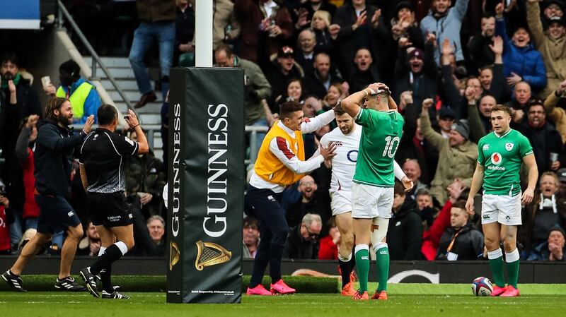 England’s Elliot Daly scores a try as Ireland captain Johnny Sexton reacts. Photograph: James Crombie/Inpho