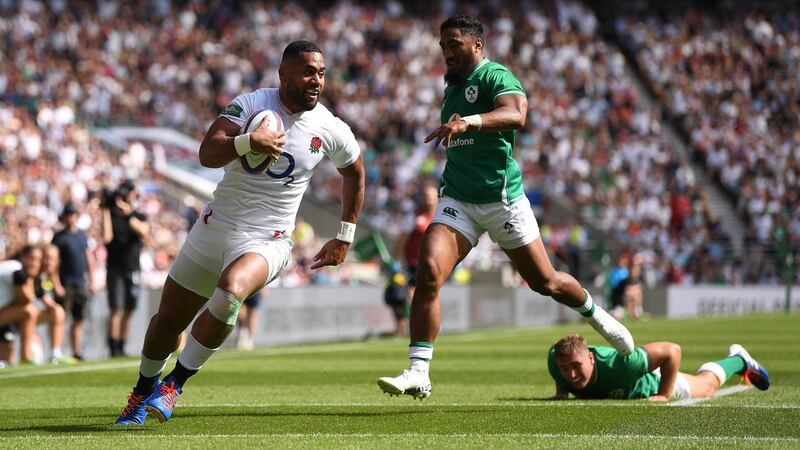 Joe Cokanasiga beats Jordan Larmour to score England’s opening try at Twickenham. Photograph: David Ramos/Getty