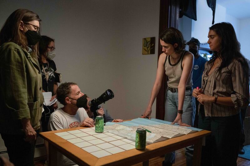 Drive-Away Dolls: Tricia Cooke (left), Ethan Coen and actors Margaret Qualley and Geraldine Viswanathan on set. Photograph: Wilson Webb/Working Title/Focus Features