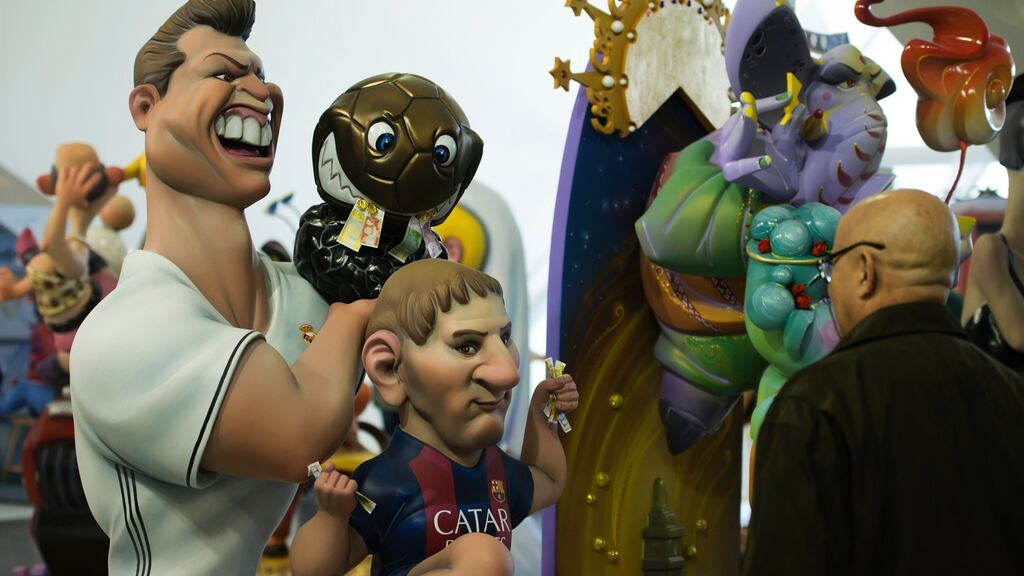 Two ‘ninots’ representing Cristiano Ronaldo and Lionel Messi on display in Valencia during the Fallas festival. Photo: Getty Images