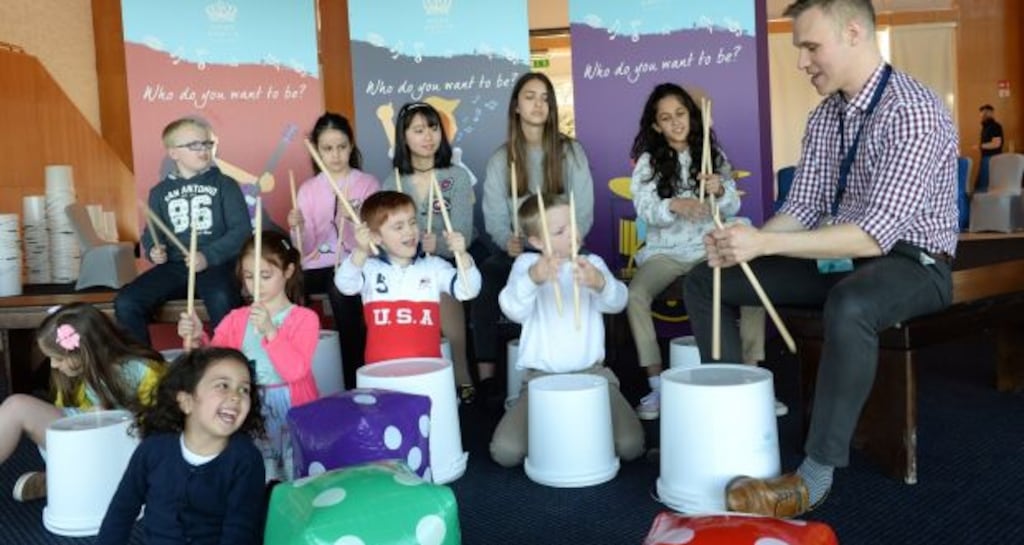 Children attending the Nord Anglia International School in a drum workshop. About €14m has been invested in the school to date. Photograph: Dara MacDónaill/The Irish Times
