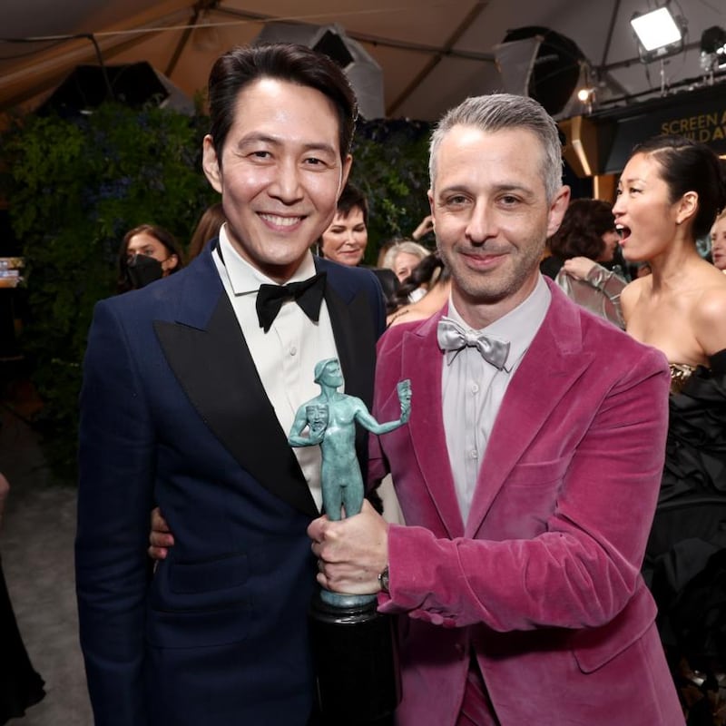 Lee Jung-jae, winner of Male Actor in a Drama Series for Squid Game, and Jeremy Strong, winner of Ensemble in a Drama Series for Succession. Photograph: Emma McIntyre/Getty Images for WarnerMedia