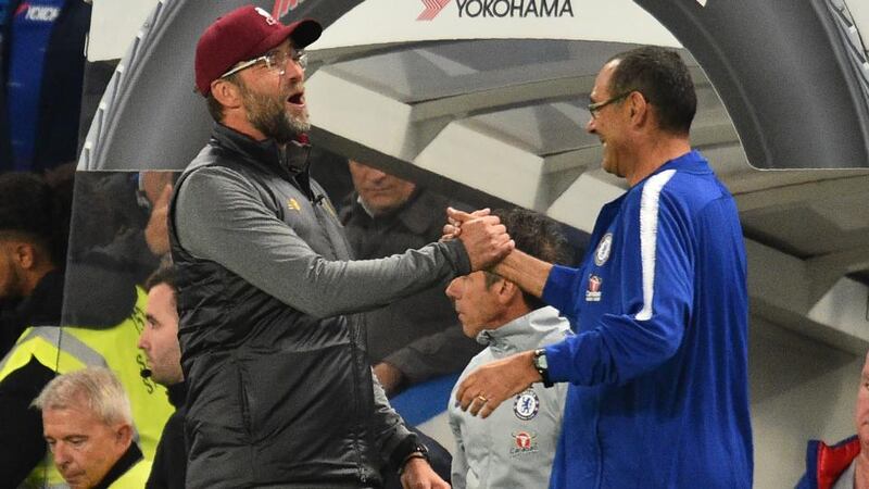 Liverpool manager Jurgen Klopp and Chelsea boss Maurizio Sarri embrace after their Premier League draw on Saturday. Photo: Getty Images
