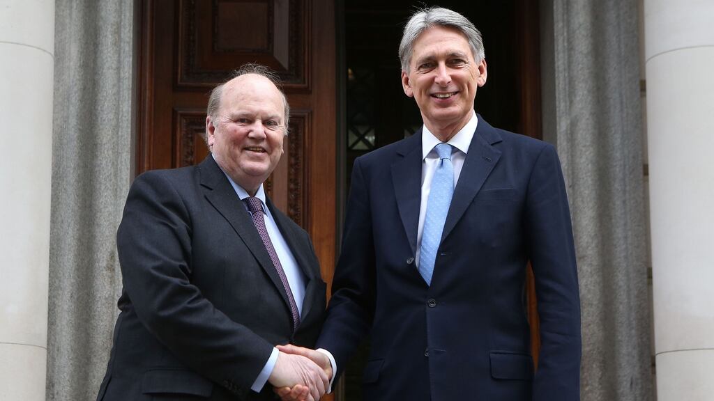Minister for Finance Michael Noonan and Britain’s chancellor of the exchequer Philip Hammond at the Treasury office in London. Photograph: Reuters