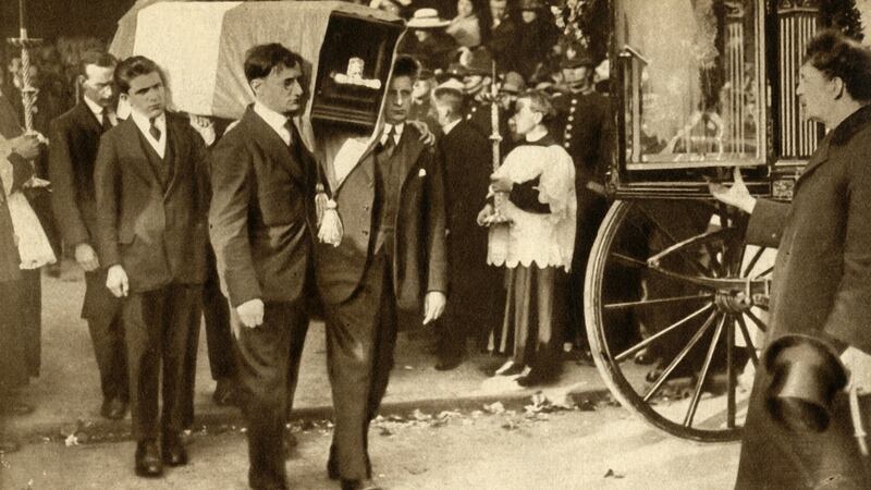 Terence MacSwiney’s coffin, wrapped in Sinn Féin colours, is carried out of the Cathedral of St Mary and St Anne in Cork. Photograph: The Print Collector via Getty Images