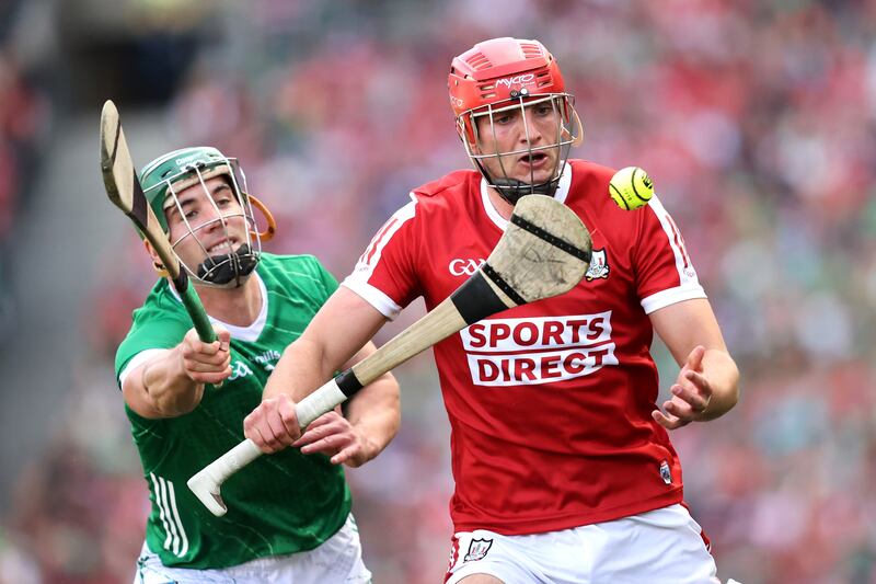 Limerick's Sean Finn with Brian Hayes of Cork. Hayes was man of the match in the semi-final. Photograph: Bryan Keane/Inpho