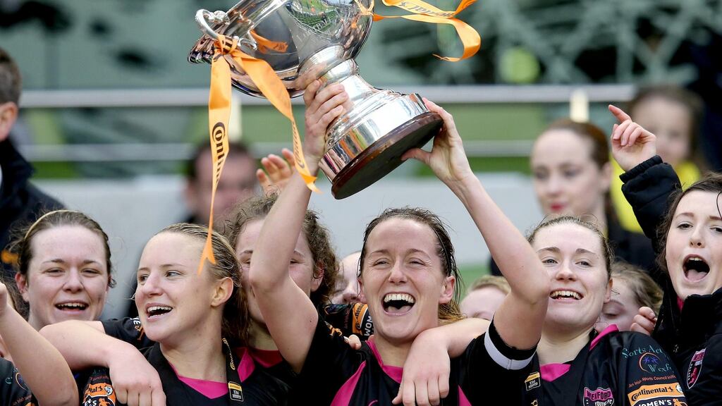 Kylie Murphy of Wexford Youths lifts the FAI Cup at the Aviva Stadium after beating Shelbourne. Photograph: Ryan Byrne/Inpho