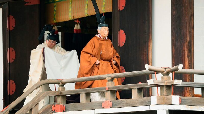 Japan’s Emperor Akihito (R) leaves after a ritual to report his abdication to the throne, at the Imperial Palace in Tokyo, on Tuesday. Photograph: Japan Pool via AP