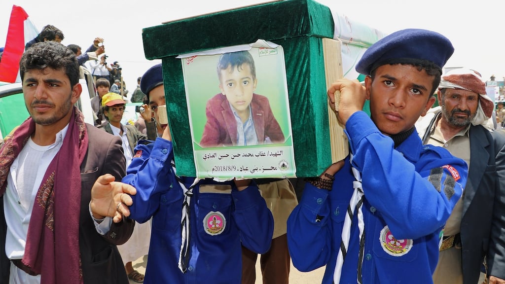 Scouts carry the coffin of a boy during funerals for children killed in a Saudi-led coalition air strike on a bus in Saada, northern Yemen. Photograph: Naif Rahma/Reuters
