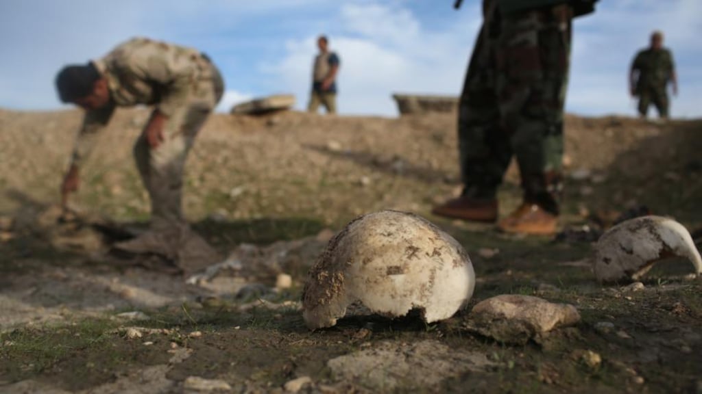 Persecuted Yazidis: Kurdish peshmerga show what they say is a mass grave of more than 50 Yazidis killed by Islamic State in Sinjar in 2015. Photograph: John Moore/Getty