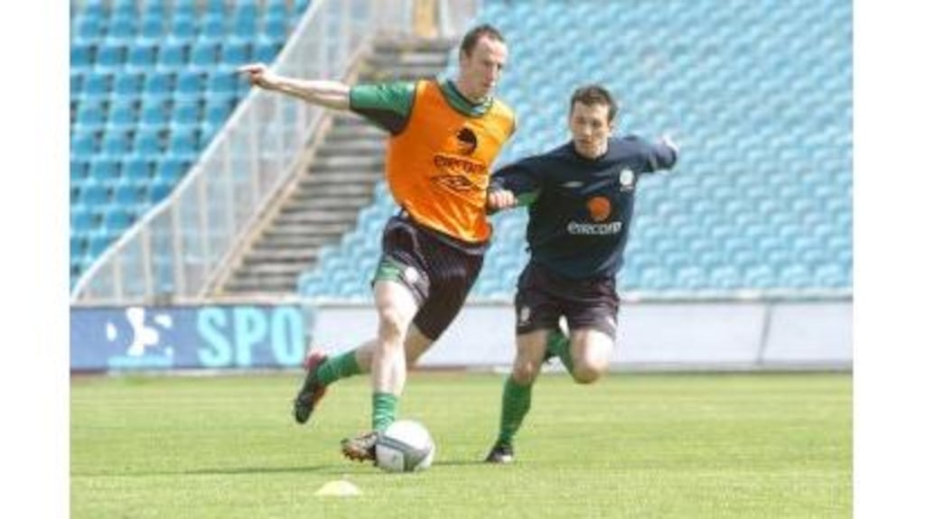 Andy O'Brien (left) and Liam Miller in action during the Republic of Ireland's training session in Bydgoszcz yesterday ahead of this evening's international friendly game against Poland