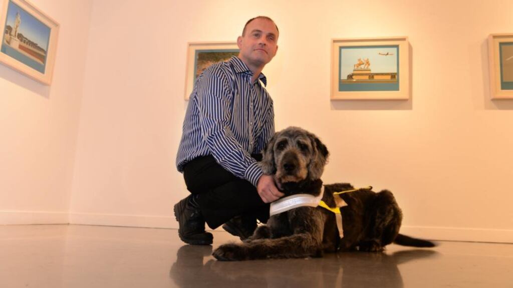 John Carroll, with his dog Vico, at the launch of the ‘Economic Cost and Burden of Eye Diseases and Preventable Blindness in Ireland’ report at RHA Gallery, Dublin. Photograph: Dara Mac Dónaill