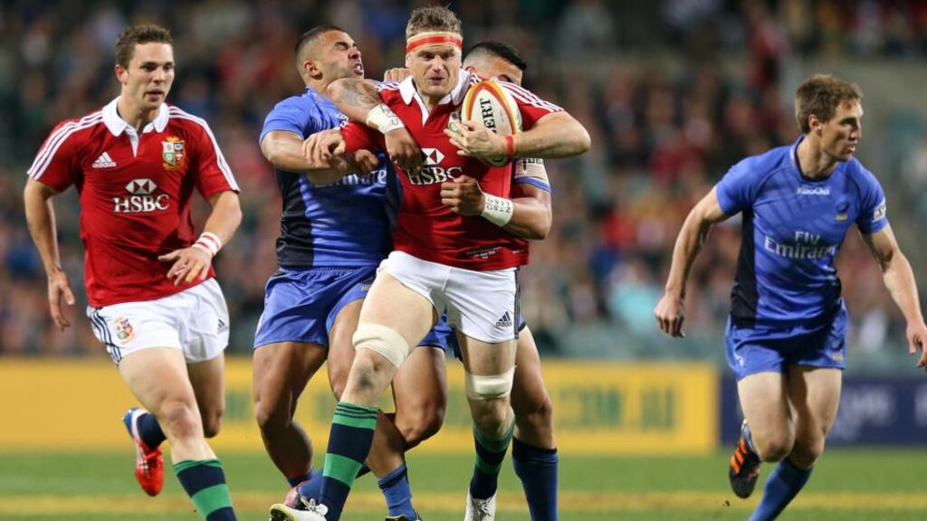 Lions’ Jamie Heaslip tackled by Chris Tuatara-Morrison and Corey Brown of Force. Photograph: Inpho