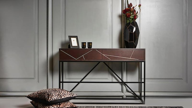 Oak veneer console table with brass inlay detail on drawers and black metal legs. Measures 140x40x90cm and priced at  €1350