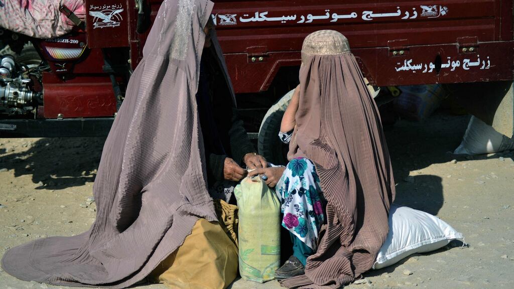 Women sorting food aid distributed by the Red Cross in Kandahar, Afghanistan. Photograph: Javed Tanveer/AFP via Getty Images