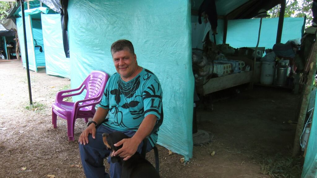 Commander Olmedo Ruiz with his dog, Costenho, of the Farc’s 57th Front at the demobilisation camp in Chocó, Colombia, on March 3rd, 2017. Photograph: Julieta Aponte