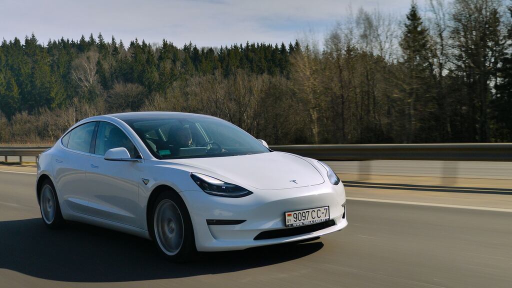 Tesla Model 3 Performance drives on a motorway