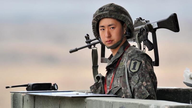 A South Korean soldier stands on a military guard post near the demilitarised zone dividing the two Koreas in the border city of Paju yesterday. Photograph: Jung Yeon-je/AFP/Getty Images)