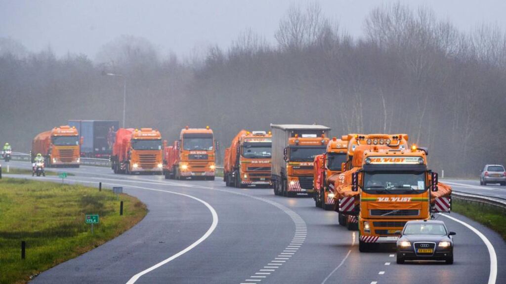 Trucks carrying the wreckage drive   to the Gilze-Rijen airbase in the Netherlands where relatives of dead passengers and crew gathered. Photograph: Vincent Jannink/EPA.