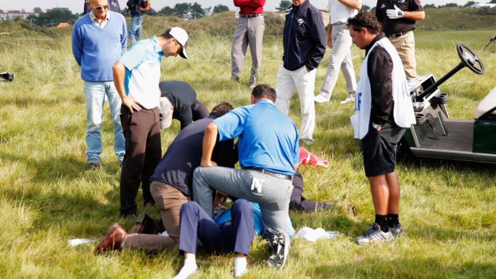 Fabrizio Zanotti of Paraguay is attended to by medical staff after being struck with a ball during Day One of the KLM Open at De Kennemer Golf and Country Club in Zandvoort. Photograph: Dean Mouhtaropoulos/Getty Images