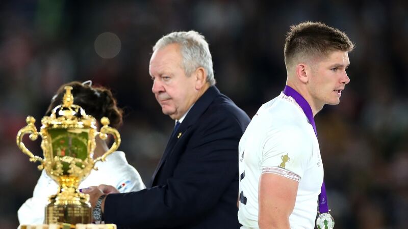 Owen Farrell walks past the Webb Ellis Cup. Photograph: Cameron Spencer/Getty