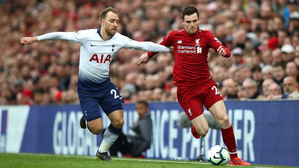 Christian Eriksen of Tottenham Hotspur tackles Andrew Robertson of Liverpool during the Premier League match at Anfield. Photo: Clive Brunskill/Getty Images