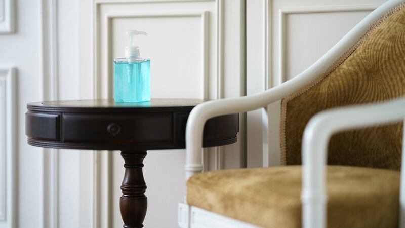 Use a side table or drinks trolley to display hand sanitizer for guests. Photograph: Getty Images