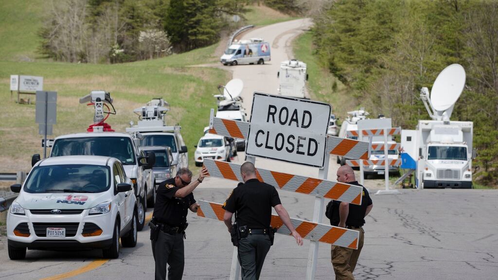 Authorities set up road blocks at the intersection of Union Hill Road and Route 32 in Pike County, Ohio. Photograph: John Minchillo/AP