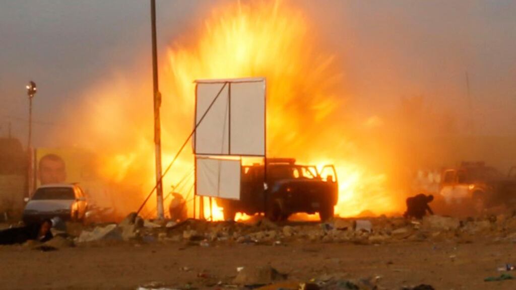 An explosion is seen during a car bomb attack at a Shia political organisation’s rally in Baghdad. Photograph: Thaier al-Sudani/Reuters