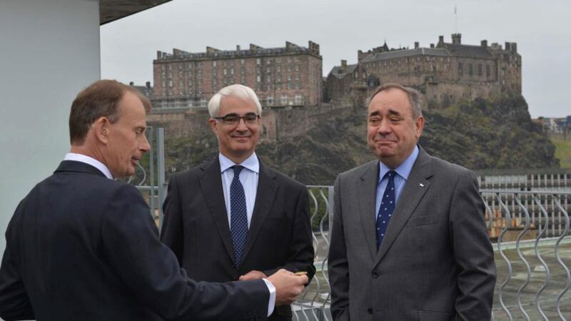 Alistair Darling(c), the leader of the campaign to keep Scotland part of the United Kingdom, and Scotland’s first minister Alex Salmond(r) watch as Andrew Marr prepares to toss a coin on the BBC’s Andrew Marr Show in Edinburgh. Photograph: Jeff Overs/BBC/Handout via Reuters