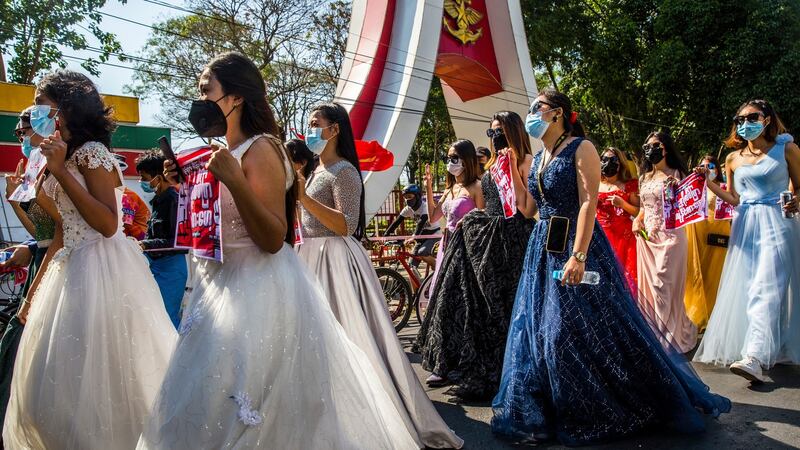 A group of women wearing formal gowns during a protest march in Yangon last month. Photograph: The New York Times