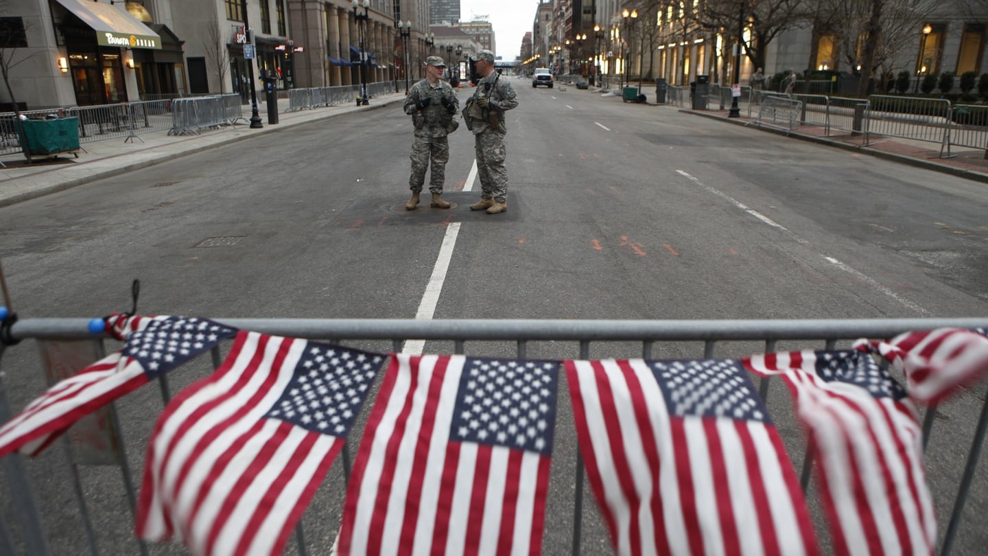 Lockdown: American flags on a roadblock in Boston the day after the bombing of the city’s marathon, in 2013. Photograph: Melanie Stetson Freeman/CSM via Getty