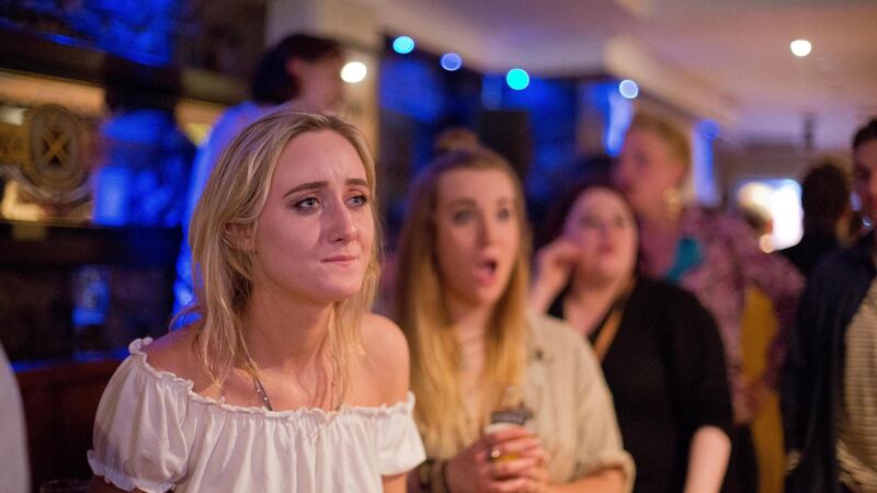 Aoibhinn Moore from Tipperary watching the final round of the Conor McGregor vs  Floyd Mayweather boxing match  in a Dublin city pub. Photograph: Tom Honan.