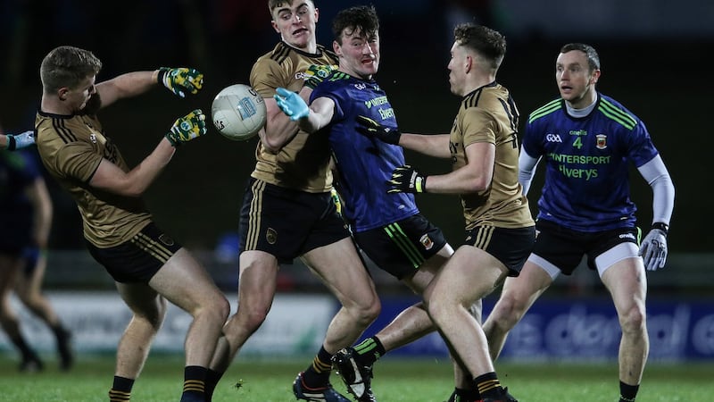 Kerry’s Gavin Crowley, Seán O’Shea and Dara Moynihan tackle Diarmuid O’Connor of Mayo during the Allianz Football League Division 1 game at Austin Stack Park in Tralee. Photograph: Cathal Noonan/Inpho