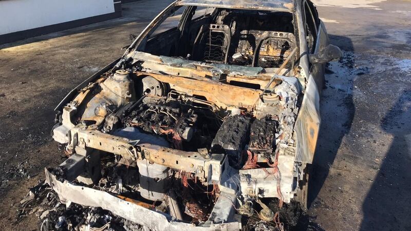 Martin Kenny’s car after it was destroyed by fire outside his home. Photograph: Supplied by Brian Farrell