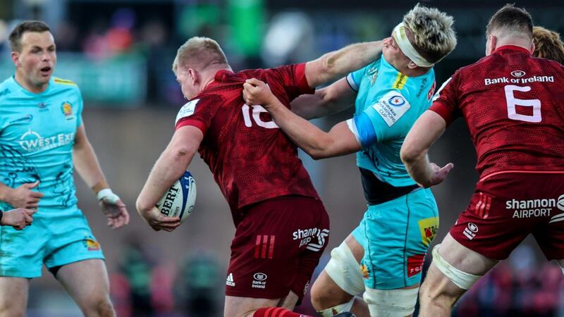 Munster’s John Ryan fends off Richard Capstick of Exeter Chiefs during the first leg of the Heineken Champions Cup Round of 16 first leg at Sandy Park. Photograph: Ben Brady/Inpho