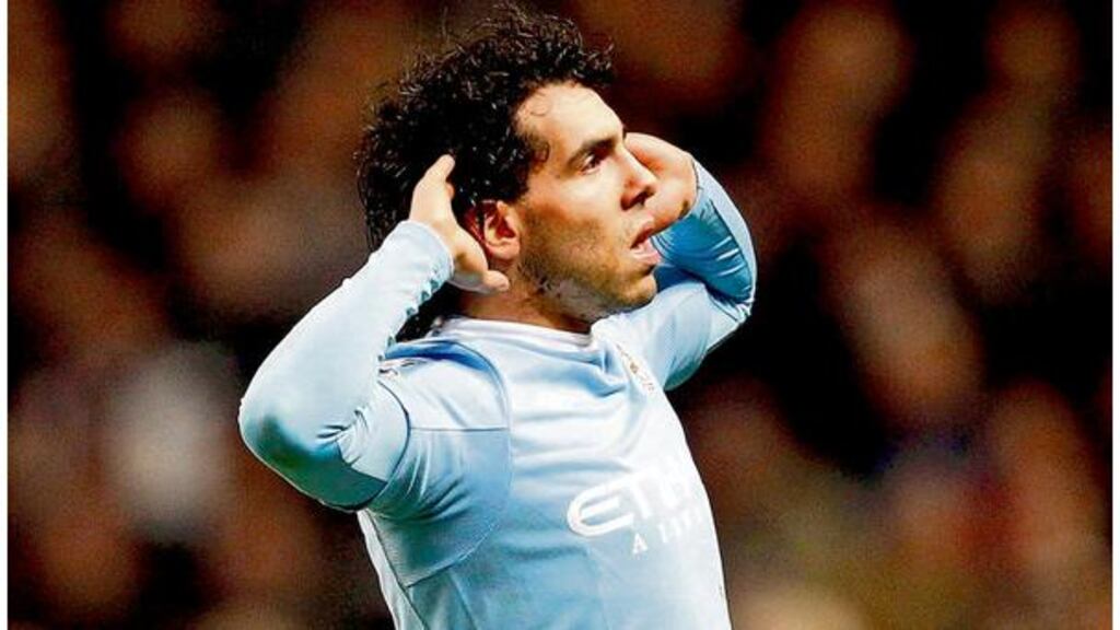 Manchester City's Carlos Tevez enjoys his moment after scoring his second goal against his former club, Manchester United, during their English League Cup semi-final first leg victory at the City of Manchester Stadium last night. - (Photograph: Phil Noble/Reuters)