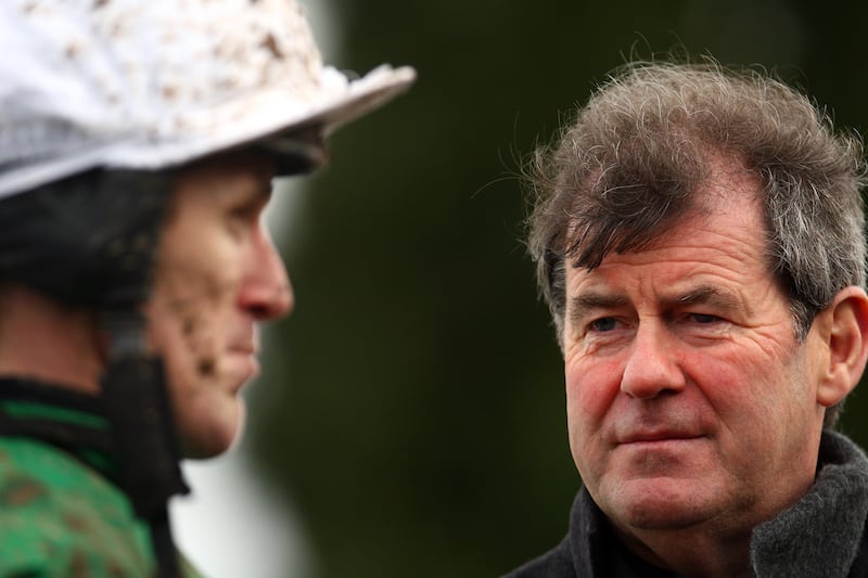 JP McManus with jockey Tony McCoy at Lingfield Park Racecourse, England, in November 2009. Photograph: Julian Herbert/Getty Images