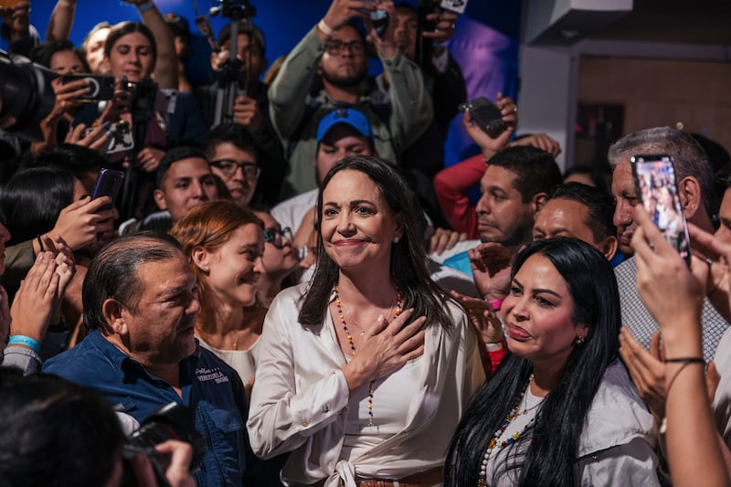 María Corina Machado, the leading opposition candidate, celebrates with supporters after hearing preliminary results of a primary election in Caracas. Photograph: Adriana Loureiro Fernandez/The New York Times