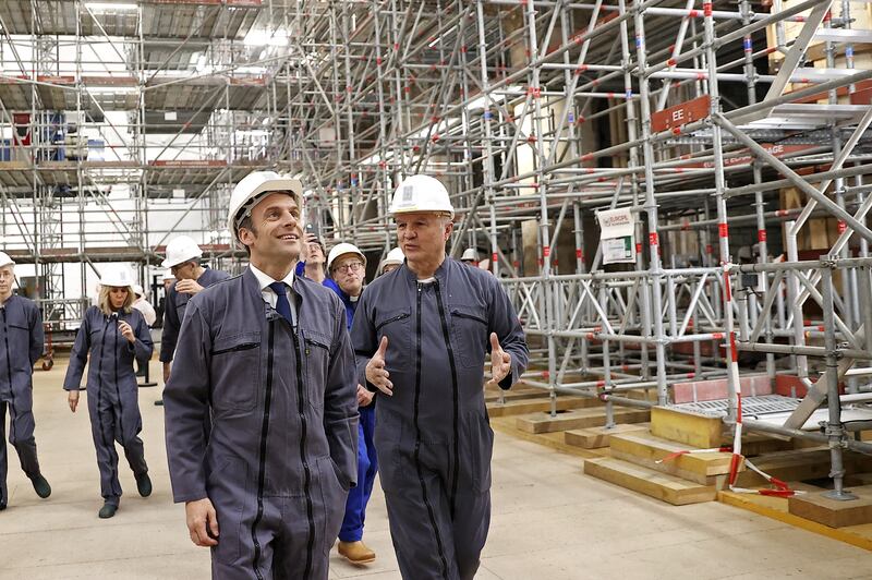 French army general Jean-Louis Georgelin (right) leads the visit of French president Emmanuel Macron at the reconstruction site inside the Notre-Dame cathedral in 2022 on the third anniversary of the fire. Photograph: Ian Langsdon/Pool/AFP via Getty Images