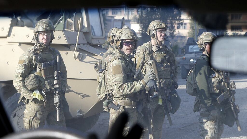 US army personnel gather at the University of Mosul during a battle with Islamic State militants on Wednesday. Photographer: Reuters/Muhammad Hamed