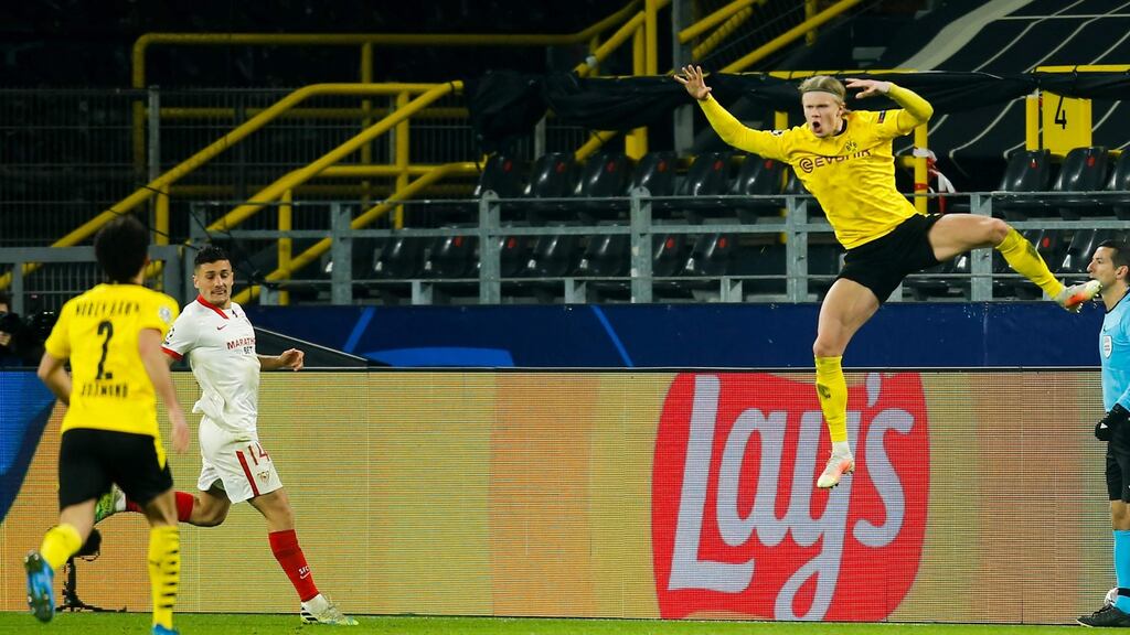 Erling Braut Haaland (R) celebrates after scoring his and Borussia Dortmund’s second goal from the penalty spot during the Champions League last-16 second leg against Sevilla at Signal Iduna stadium in Dortmund. Photograph: Leon Kügeler/AFP via Getty Images
